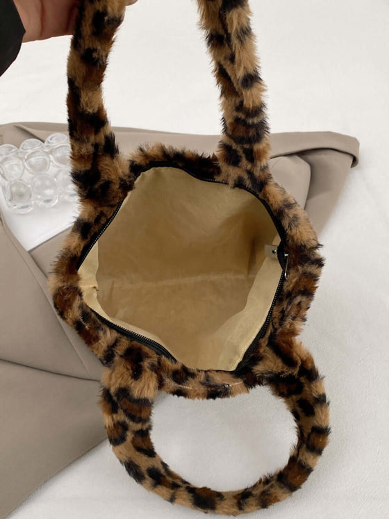 Inside view of the Leopard Fluff Handbag with Zip, showcasing its plush material and spacious interior.