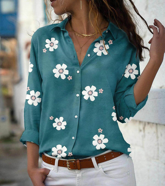 Women's solid color floral print long-sleeved shirt with lapel collar.