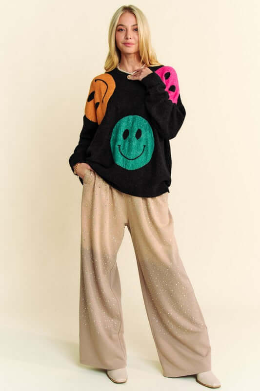 Women's contrast smile round neck oversize sweater with playful design and relaxed fit.