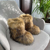 Women's closed toe warm plush snow boots with faux fur, displayed on a chair with green plants in the background.