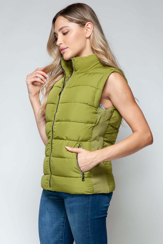 Snobbish Zip Up Turtleneck Vest with PocketsComplete your wardrobe with our Snobbish Zip Up Turtleneck Vest! With a stylish zip-up front and cozy turtleneck, this vest offers both fashion and warmth. The additCoatsPlush Fashion ShopPlush Fashion ShopSnobbish Zip