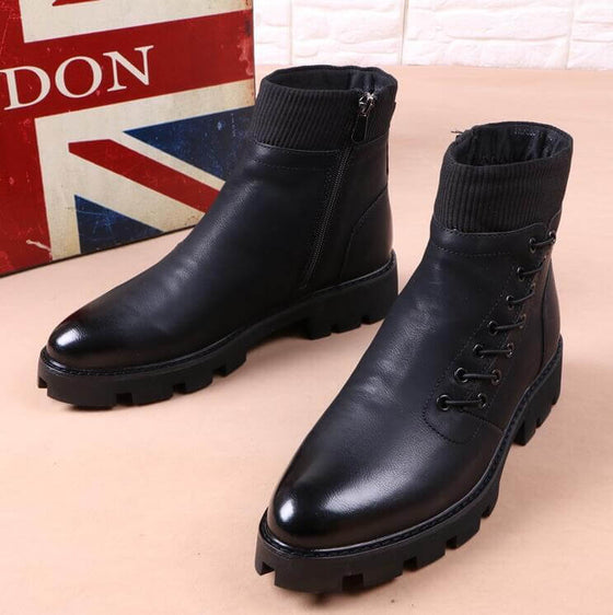 Women's black ankle motorcycle boots with rubber soles and stylish design, perfect for spring fashion.