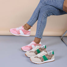  Contrast round-toe flat sneakers in pink and green, showcasing style and comfort for everyday wear.