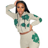 Women's sports two-piece short suit with vibrant print and flattering fit.