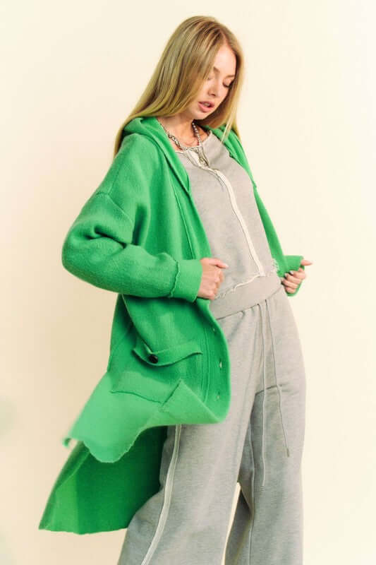 Davi & Dani Side Slit Button Up Hooded Cardigan in green, featuring side slits and a button-up front, worn by a model.