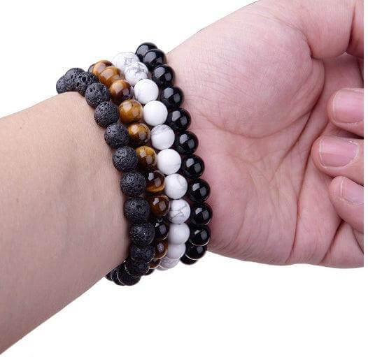 Black Onyx BraceletExperience the power of the Black Onyx Bracelet. Made with an imported elastic cord and featuring 8MM geometric black agate beads, this bracelet is not just stylish BraceletPlush Fashions ShopPlush Fashion ShopBlack Onyx Bracelet