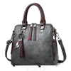 Ladies luxury crossbody handbag with soft surface material, spacious zipper, and adjustable strap.