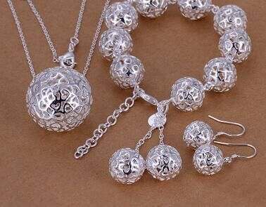 Silver-plated ball pendant necklace and bracelet set with earrings, fine jewelry collection.