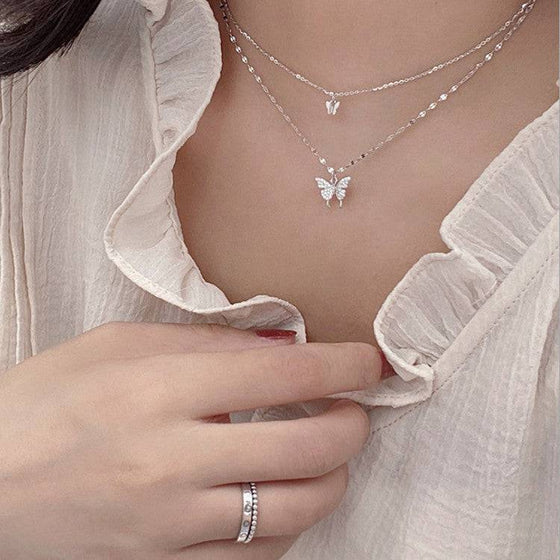 Elegant silver butterfly necklace with double-layer clavicle chain for women.