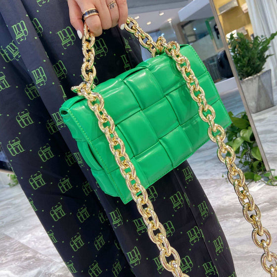 Woven small cowhide square chain shoulder handbag in green with a gold chain.