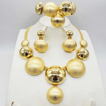  Four-piece alloy jewelry set with electroplating, featuring necklaces and pendants, earrings, and accessories in gold tones.