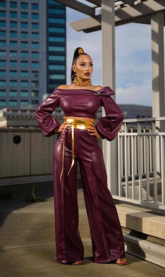 Personality Fashion Leather Suit Women in wine red with trendy stitching, model on urban rooftop.