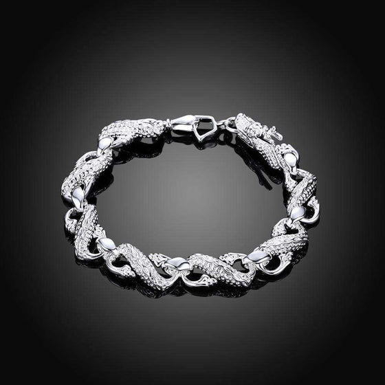 Unisex white dragon bracelet in silver with intricate detailing.