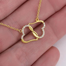  Fashion Double Heart Love Rhinestones Women's Necklace with gemstones and rhinestones on gold chain.