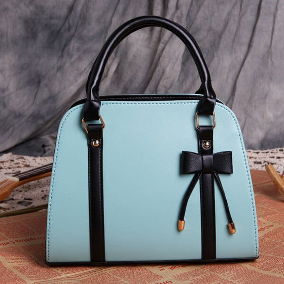 ETUDE shark summer version bow lady handbag with playful design and elegance.