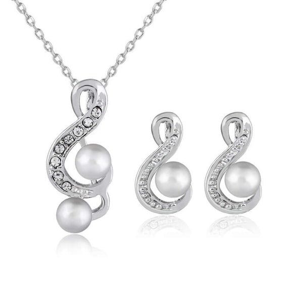 Elegant Danby Jewelry set with lustrous pearls and crystals, necklace and earrings.