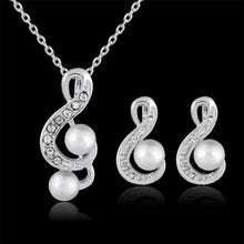  Elegant Danby Jewelry set with pearls and crystal accents.