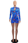 V-neck printed sheath skirt long sleeve jumpsuit in blue with butterfly pattern.