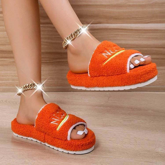 Peep toe house slippers for women, winter furry shoes in orange, stylish and cozy design.