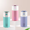 Adjustable spray size USB mini office car humidifier in multiple colors displaying compact design.