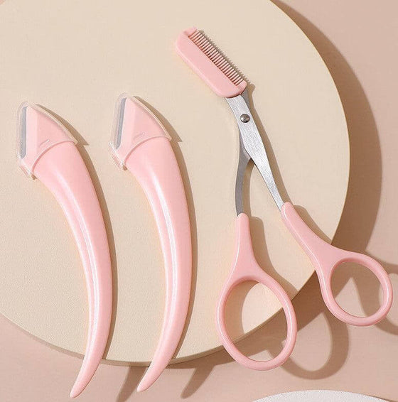 Eyebrow trimming tools with pink handles and comb attachments for precise shaping.