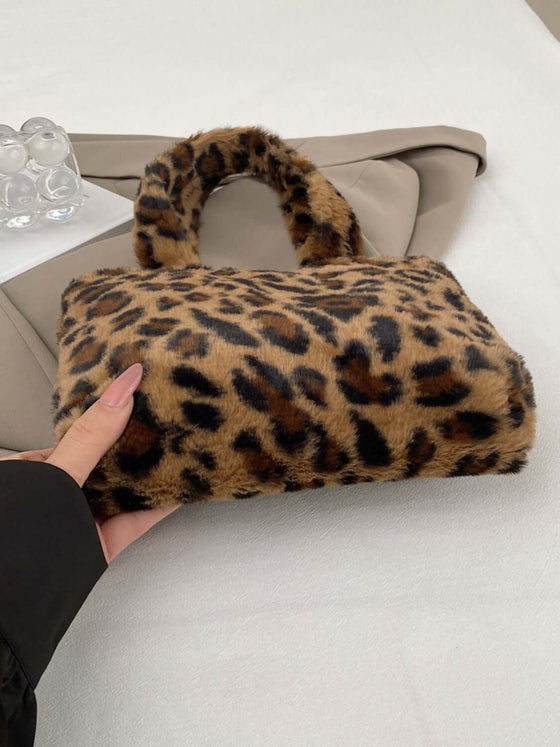 Leopard fluff handbag with zip, showcasing luxurious design and high-quality material, perfect for stylish outfits.