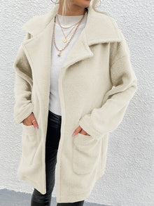  Shiny cream dropped shoulder coat with pockets, 100% polyester.