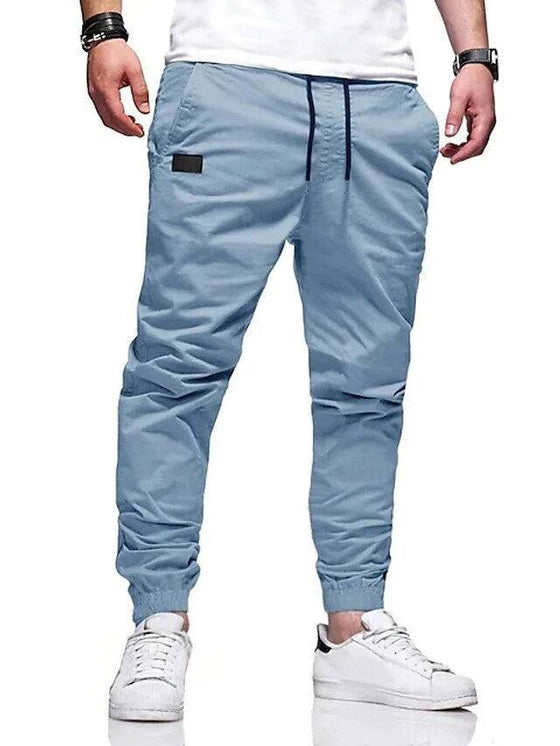 Youth fashion casual tether loose cargo ankle banded pants in blue with straight-leg design.