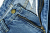 Close-up of high-quality denim fabric on low waist jeans with zipper and button details.