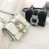 Women Designer Diamond Lock Bags in black and white with elegant diamond-locked design.