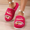 Peep Toe House Slippers for Women in pink, luxury winter furry shoes on wooden floor.