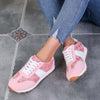 Pink contrast round-toe flat sneakers with white laces and rubber sole, perfect for stylish comfort and everyday wear.