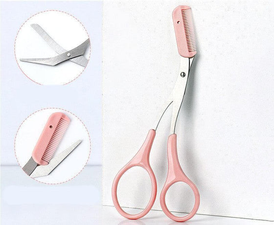 Eyebrow trimming knife with pink handles and comb attachment for precise shaping.