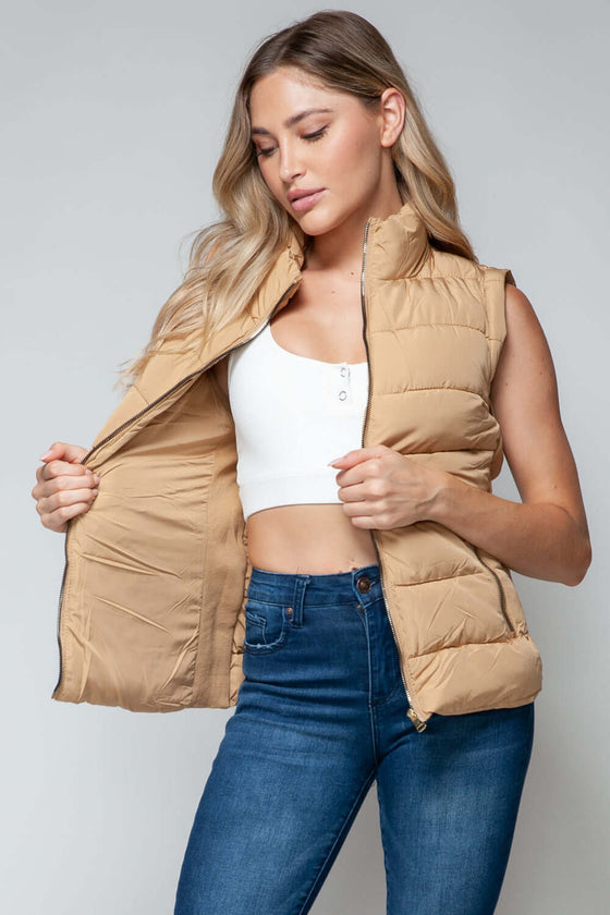 Snobbish Zip Up Turtleneck Vest with PocketsElevate your outfit with the Snobbish Zip Up Turtleneck Vest with Pockets. Designed with a convenient zip-up front closure and cozy turtleneck, this versatile vest oVestPlush Fashion ShopPlush Fashion ShopSnobbish Zip