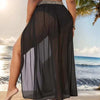 Women's plus size breathable mesh split beach skirt in solid color on the shore.