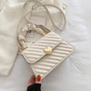 Women handbag with chain and love metal design, white PU material, fashion shoulder bag.