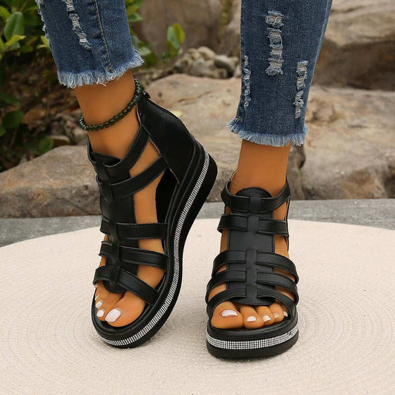 Cutout Rhinestone Trim Wedge SandalsElevate your style with our Cutout Rhinestone Trim Wedge Sandals! These comfortable flats feature a wedge heel that adds height without sacrificing comfort. Made witShoesPlush Fashion ShopPlush Fashion ShopCutout Rhinestone Trim Wedge Sandals