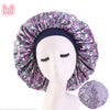 Beauty print Satin silk Bonnet sleep night cap in floral pattern on mannequin head.