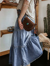 Tiered Button-Fly Denim Skirt with belt and accessories.