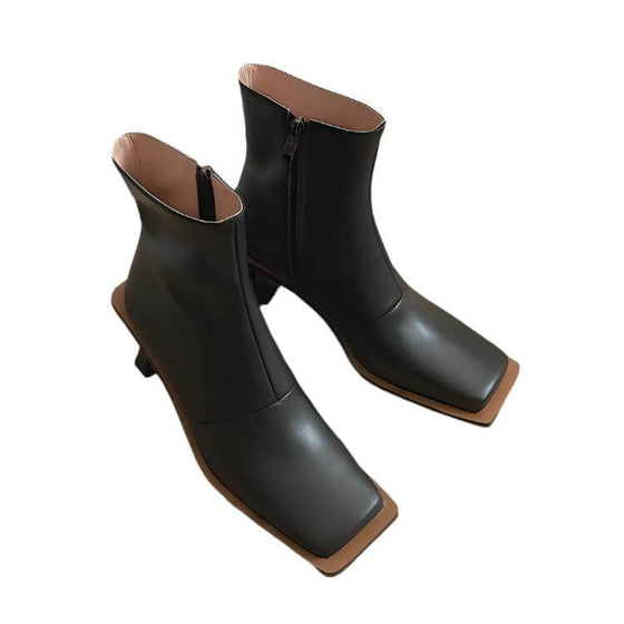 Fashion leather high-heeled Martin boots with side zipper and rubber sole.