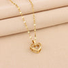 Double-layer gold chain heart pendant titanium steel necklace.