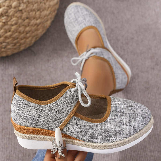 Tied Cutout Wedge Slip-OnsStep into style and comfort with our Tied Cutout Wedge Slip-Ons! Made with high-quality elastomer and polyester materials, these mid heel shoes are perfect for any oShoesPlush Fashion ShopPlush Fashion ShopTied Cutout Wedge Slip-Ons