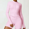 Women's tight long sleeve yoga wear in cherry blossom powder color, comfortable nylon fabric.