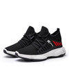 Men's breathable mesh sports sneakers with fly woven design and EVA sole.