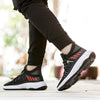 Men's breathable mesh sports sneakers in black with red accents, featuring a stylish fly woven mesh design and EVA sole for comfort.