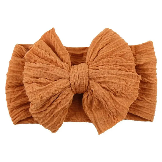 Newborn Solid Cable Baby Bow Headband for ChildEnhance any outfit with our Solid Cable Bow Baby Headband! Stretchy, soft Nylon material won't hurt your baby's head and will grow with them. Available in 20 colors,HairbowsPlush Fashions ShopPlush Fashion ShopNewborn Solid Cable Baby Bow Headband