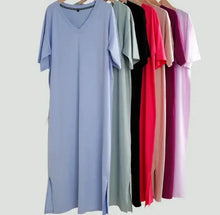  Oversized V neck women boho dresses in various colors hanging on hangers.