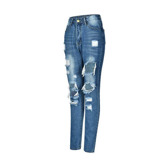 Low waist jeans with distressed and washed denim in blue.