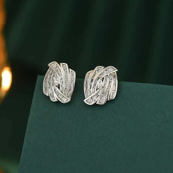 Elegant micro zircon stud earrings in electroplated silver with geometric design.