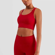  Plush sports accessories two-piece yoga suit in Chinese red with a cross-backless bra and cropped pants.